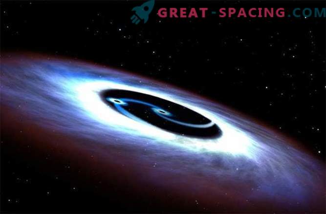 Schwarze Löcher kreisen in einer tödlichen Schlacht um einen Quasar